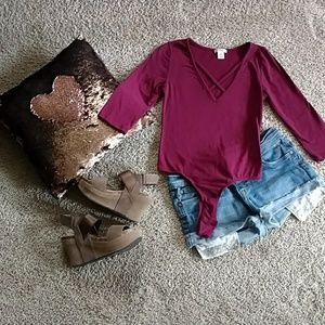 NWOT size M body suit with criss cross